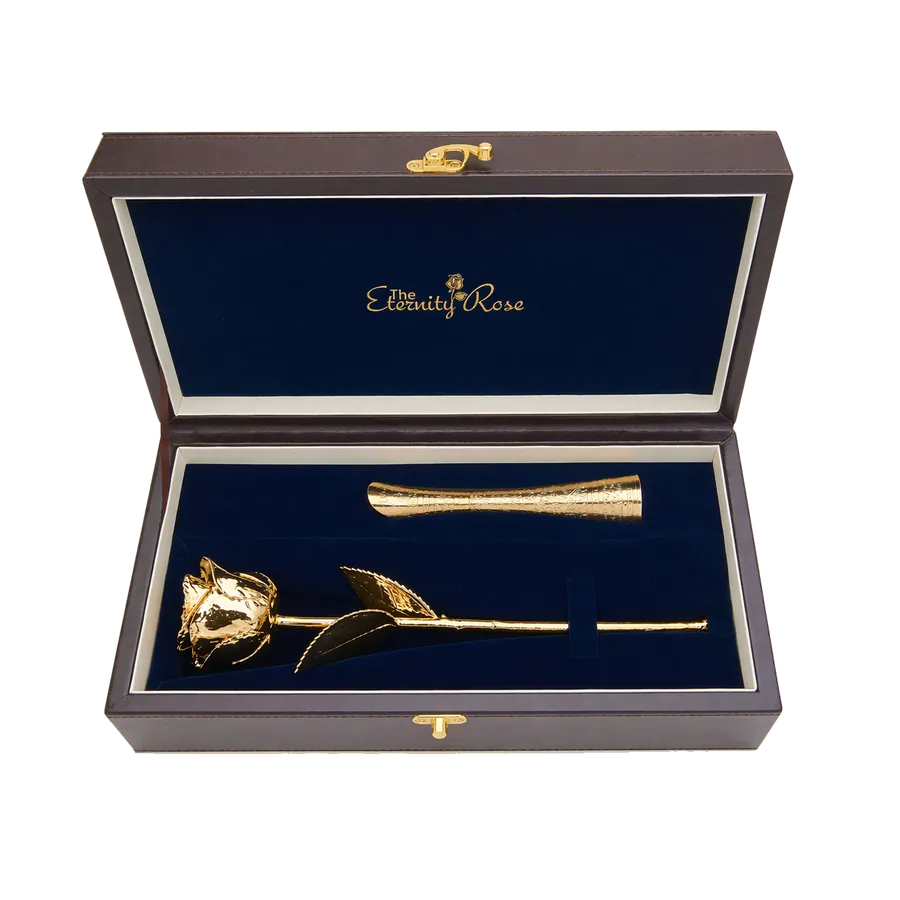 A gold-finished natural rose and matching vase in a fitted presentation case