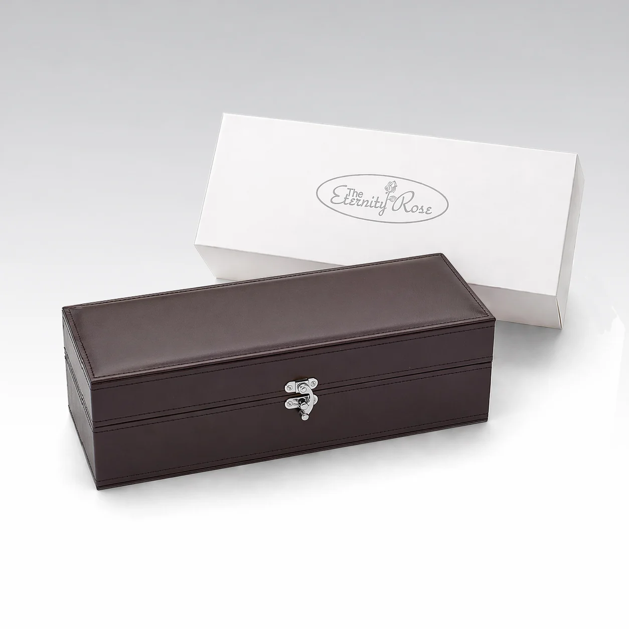 The silver rose leather presentation case with its white display box